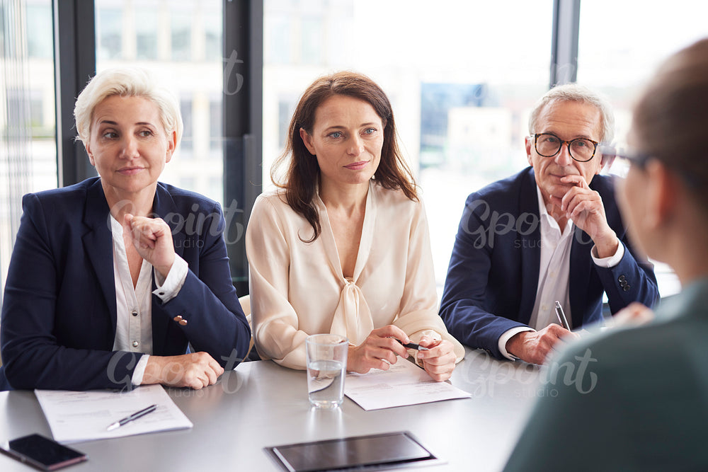 Business people having a conversation at conference table