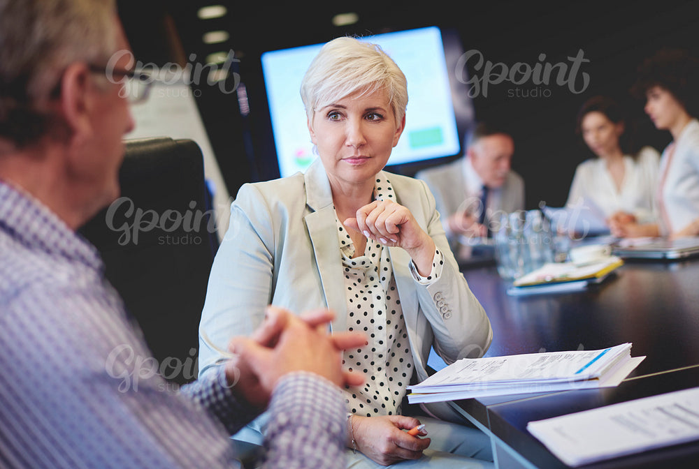 Woman listening carefully other colleague