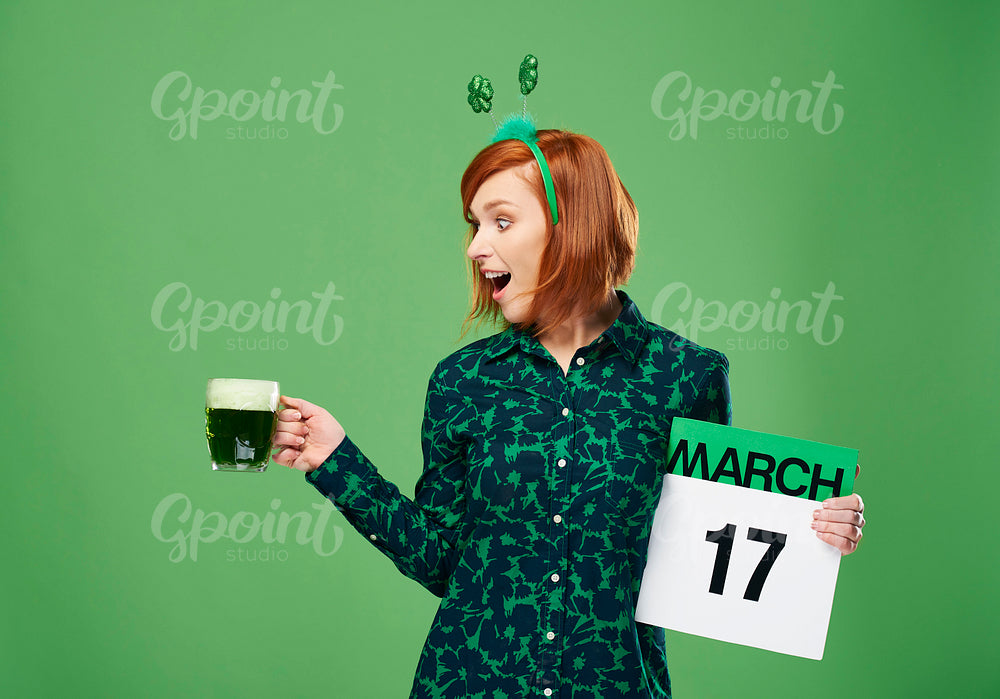Screaming woman with a full mug of beer and calendar