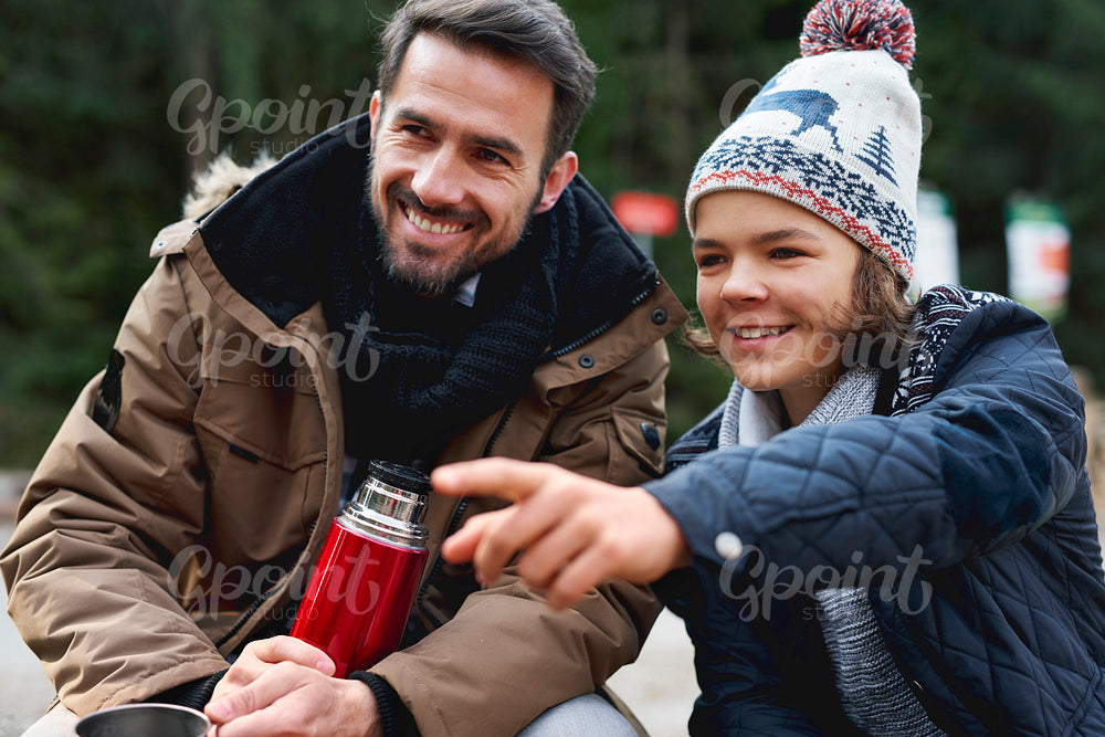 Smiling father and his son spending tome together outdoors