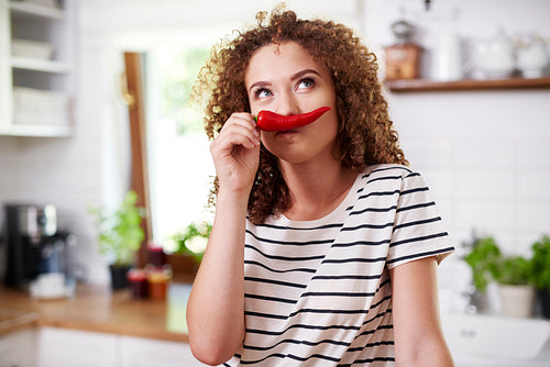 Chili pepper used as funny mustache