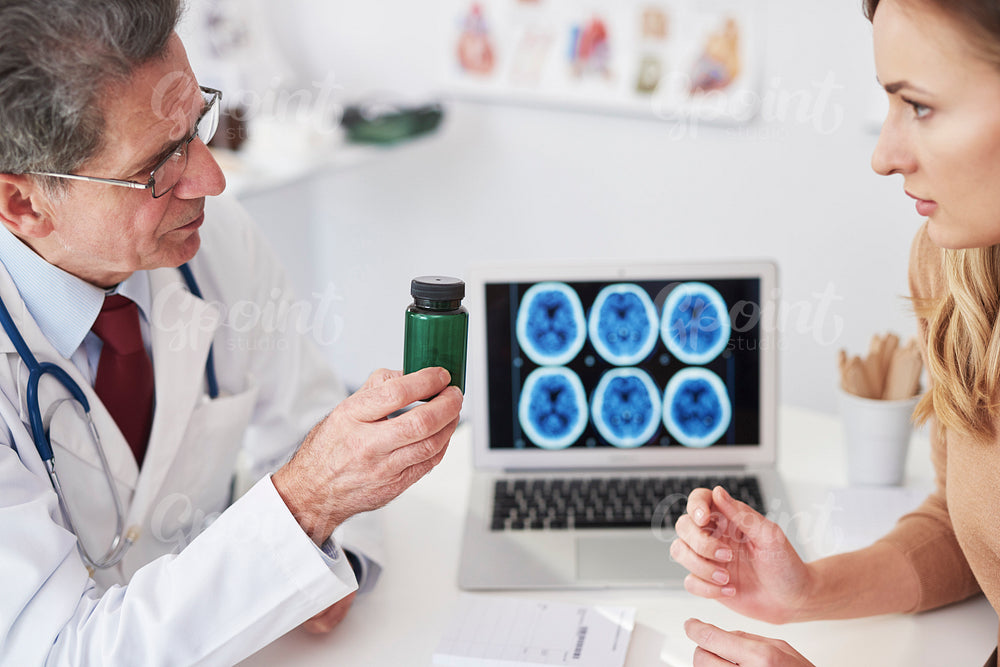 Doctor recommending vitamins to the patient