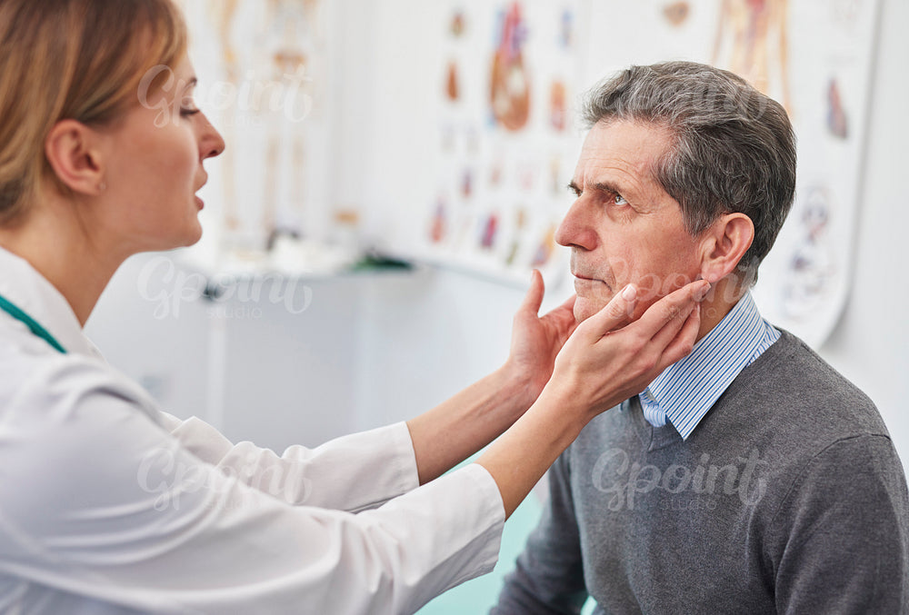 Senior man during routine examination at the doctor