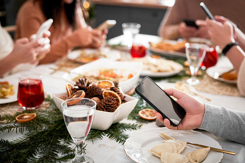Family spending Christmas Eve with mobile phones