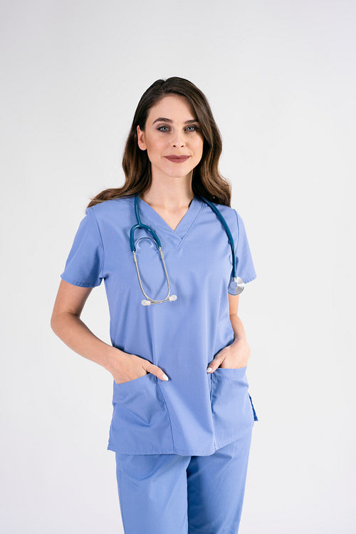 Portrait of smiling nurse with stethoscope in studio shot