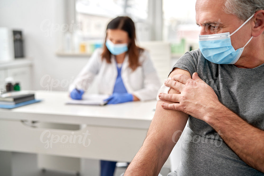 Senior after vaccination at a doctor's office