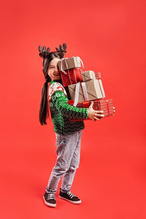 Pile of gifts held by child