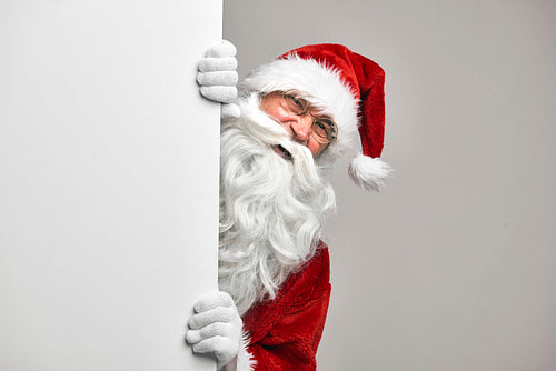 Caucasian Santa Claus with white blackboard
