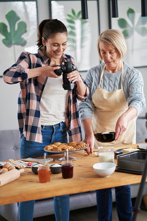 Vertical image of two food bloggers
