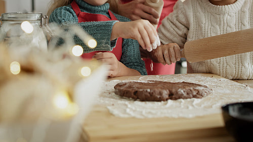 Handheld video of children making gingerbread pastry