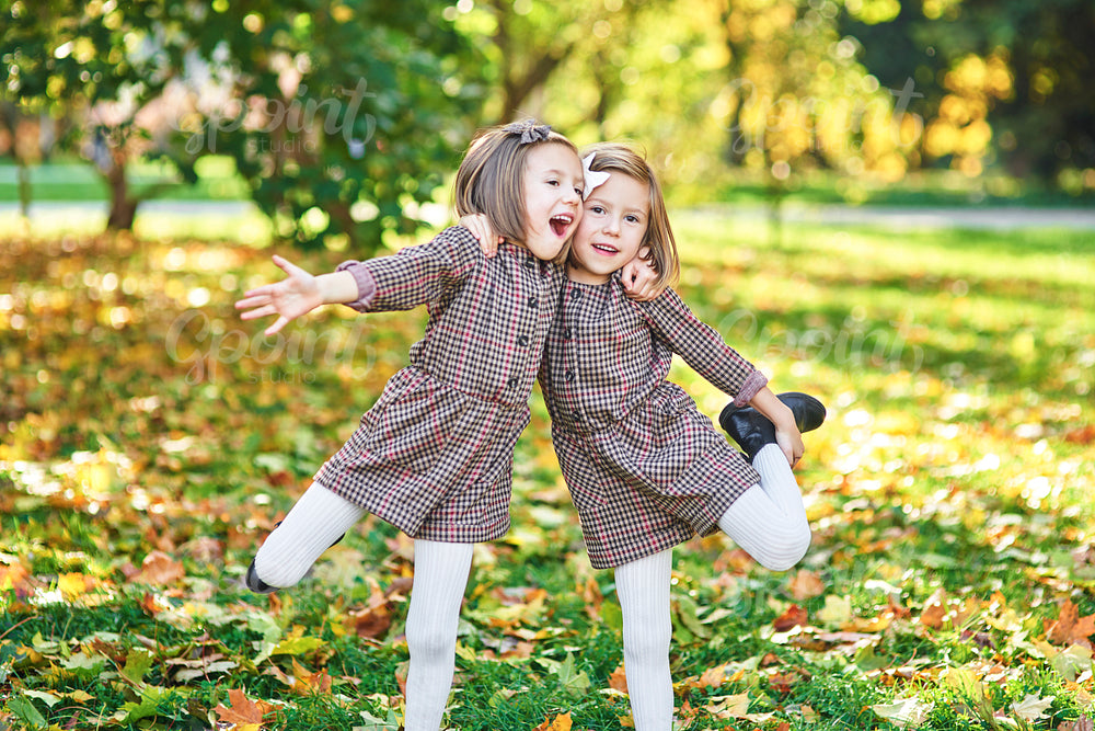 Twin girls embracing each other