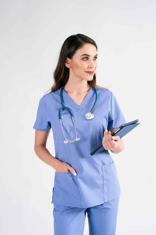 Female doctor with tablet and stethoscope in studio shot