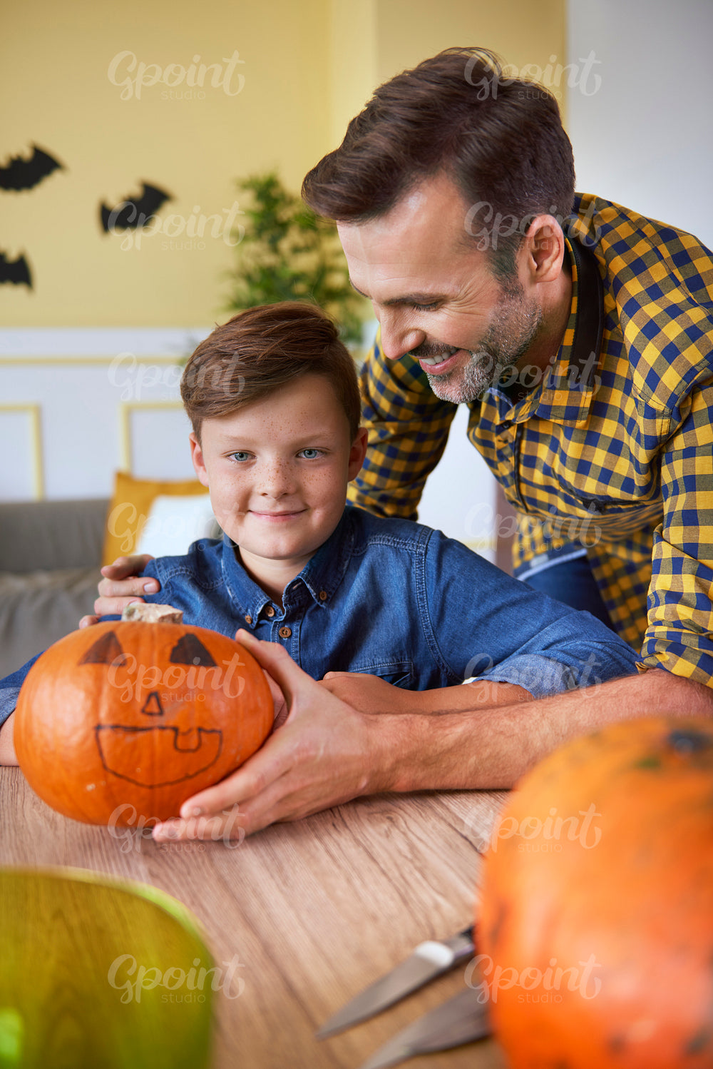 Portrait of boy with halloween pumpkin