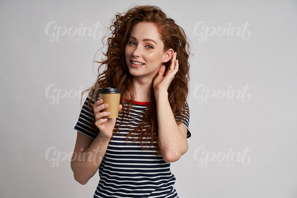 Redhead woman with cup of coffee 