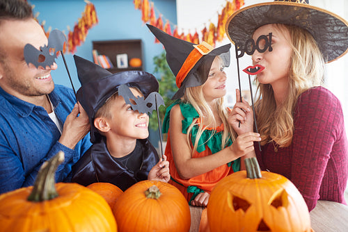 Playful family in halloween masks