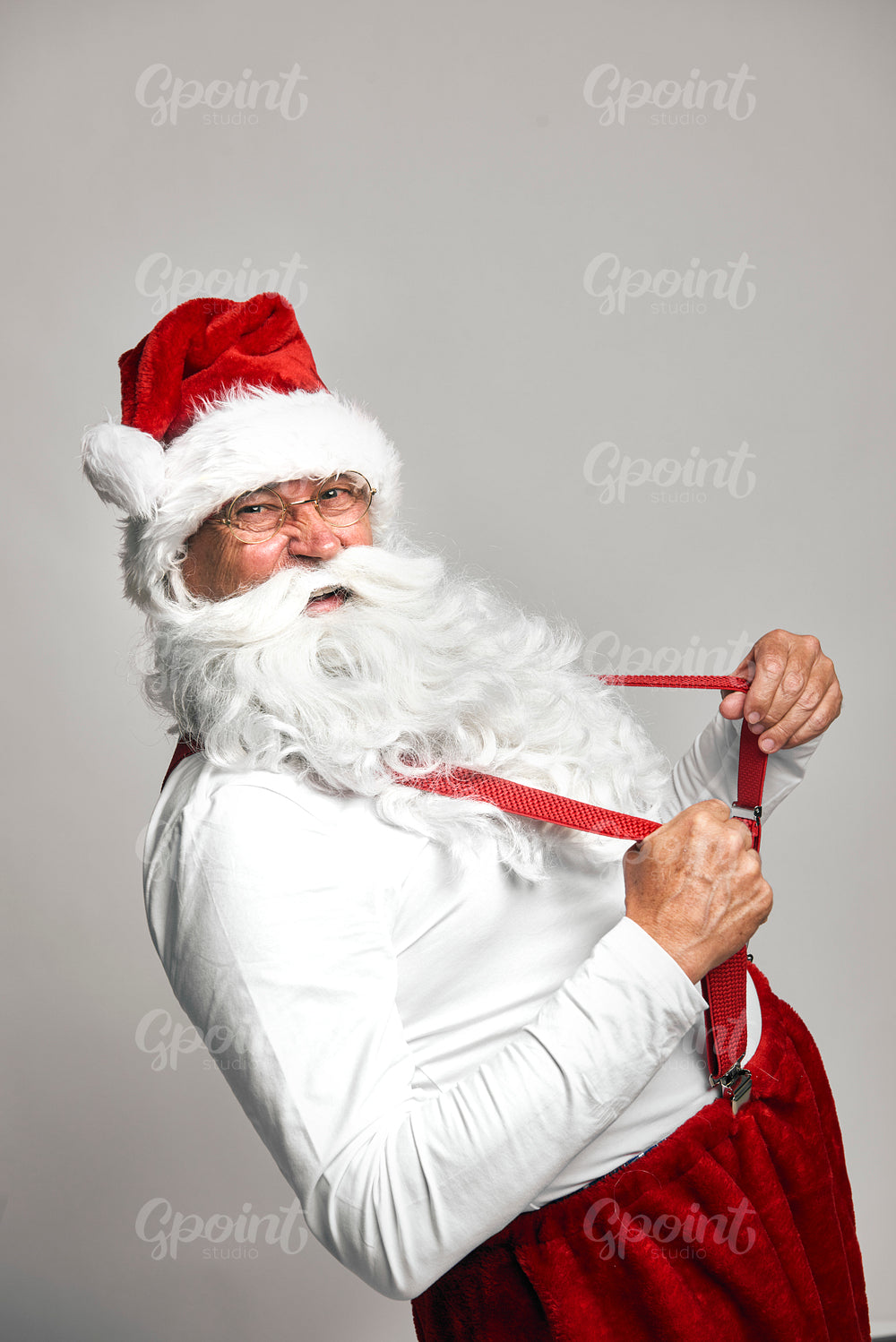 Dancing Santa Claus with red suspenders
