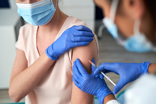 Close up of woman during vaccination in a doctor's office