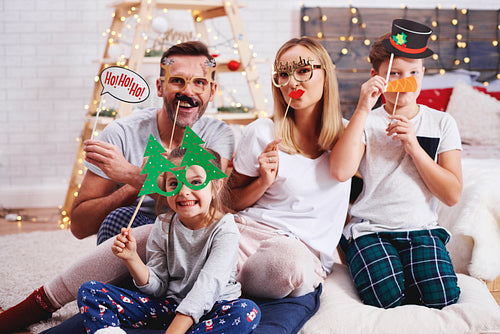 Portrait of happy family with christmas mask
