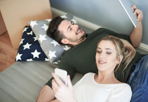 Young couple with digital tablet and smart phone