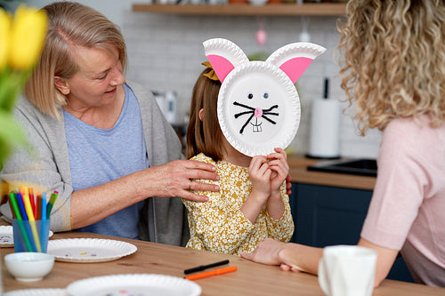 Girl have fun during making handmade Easter decorations