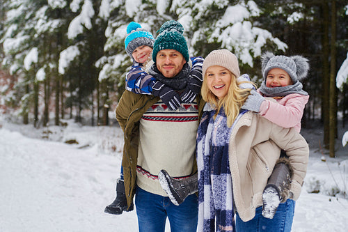 Portrait of smiling family at winter day