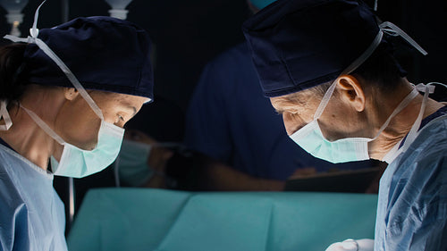 Discussion of two surgeons during serious operation