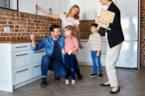Happy family during buying a new apartment