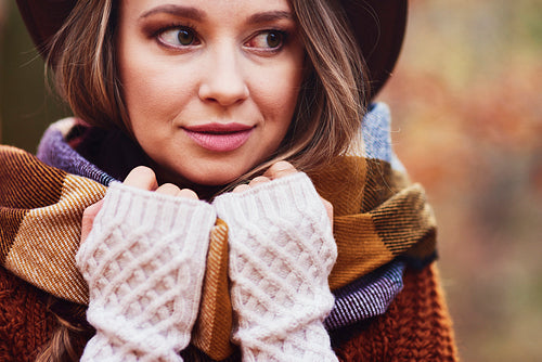 Close up of beautiful young woman in warm clothes