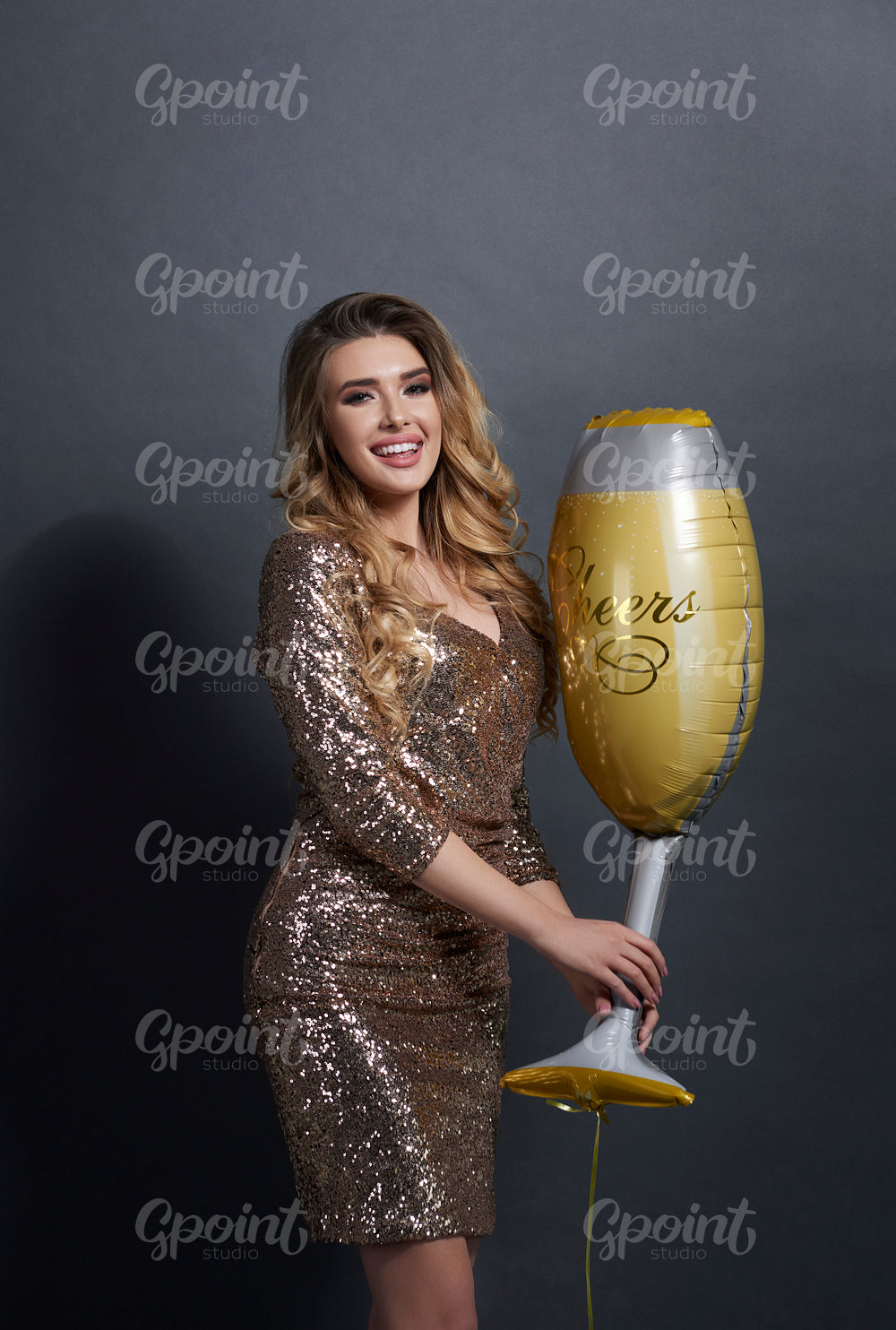 Portrait of playful woman with champagne flute