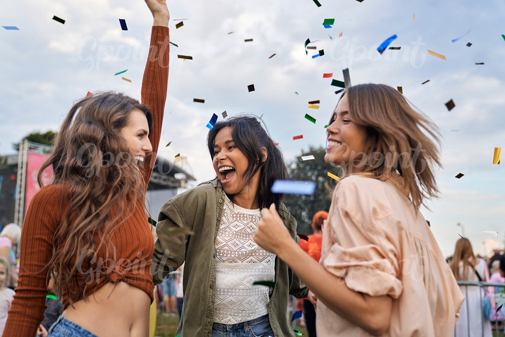 Group of friends have fun at the music festival 