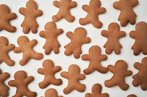 Top view of gingerbread man cookies on white background