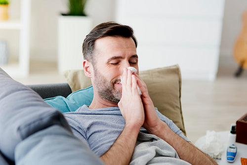 Man at home with a hard flu