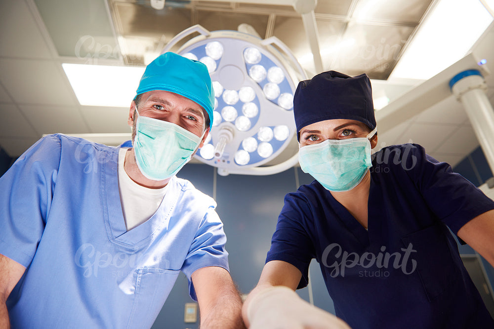 Portrait of two surgeons over the operating table