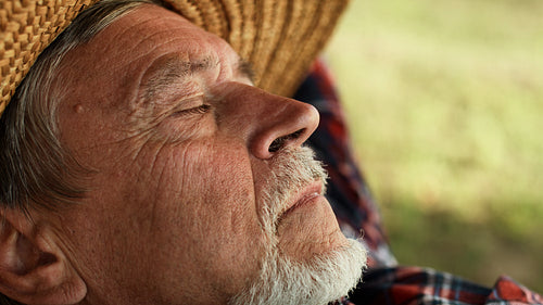 Senior man relaxation in hammock