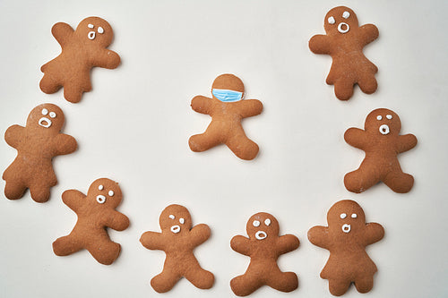 Group of gingerbread man and one with face masks