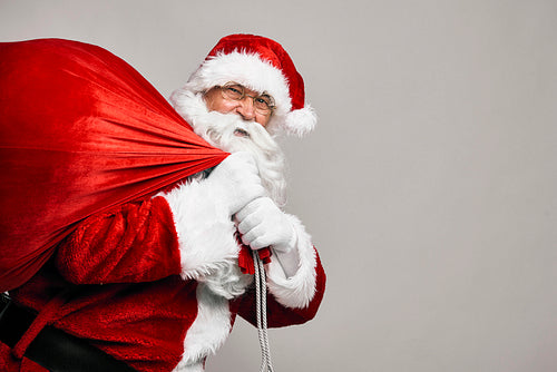 Portrait of Santa Claus with bags of presents