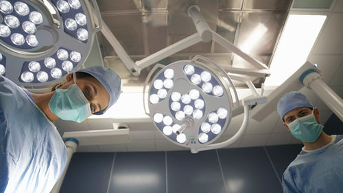 Surgeon setting the surgical light during an operation