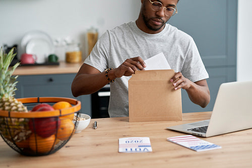 Black man voting from home by mail