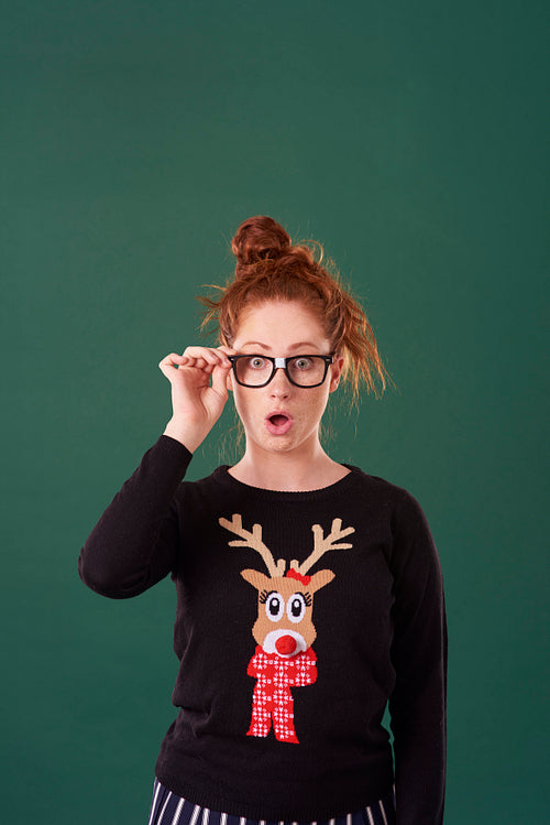 Shocked woman in christmas clothes