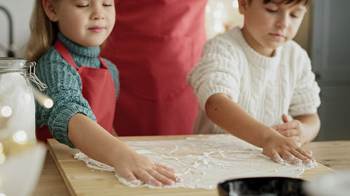 Video of mother and children prepared for Christmas baking