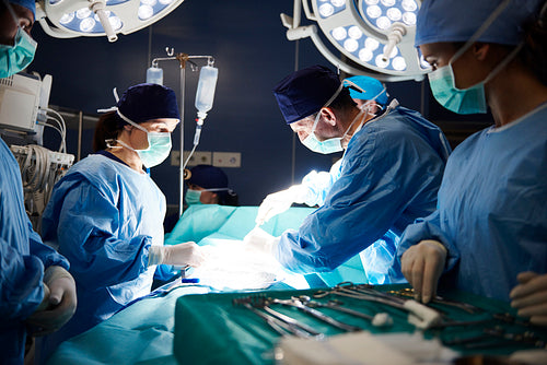 Busy surgeons during difficult operation