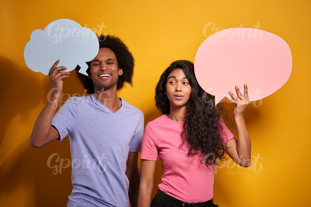 African couple holding a speech bubble