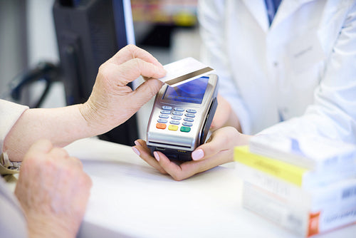 Close up of contactless payment at pharmacy