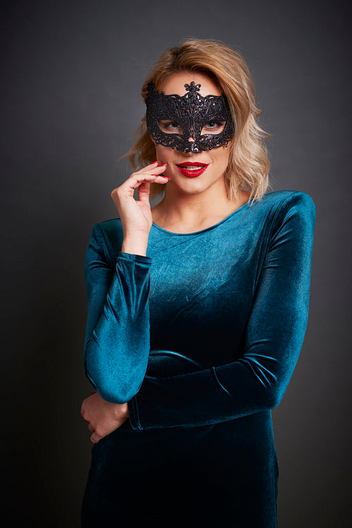 Beautiful woman with masquerade mask  in studio shot
