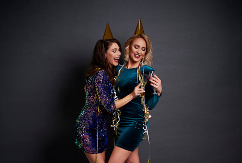 Cheerful women making toast to good new year