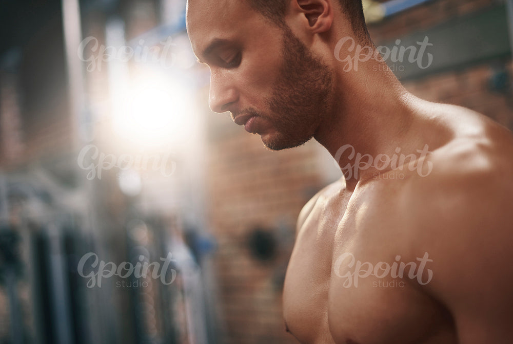 Side view of confident man in the gym club