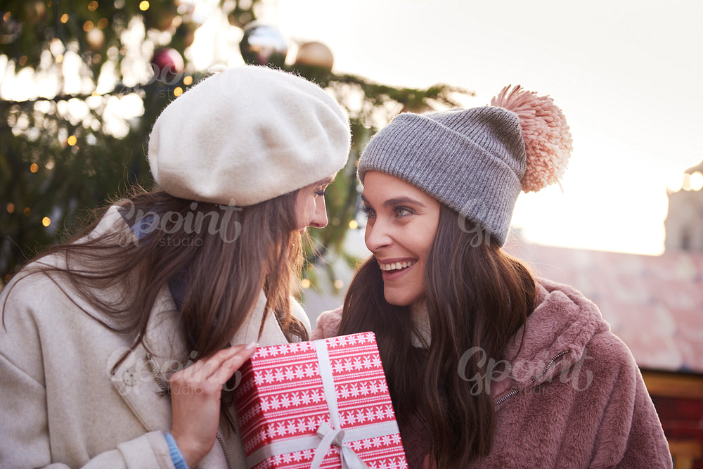 Two women with one Christmas gift