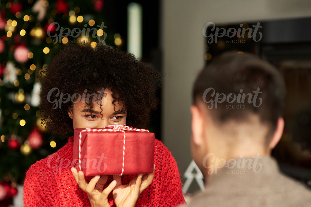 African woman giving the Christmas gift