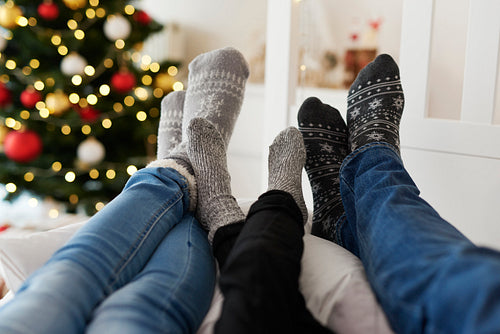 Close up of family’s legs in warm socks