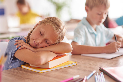 Girl sleeping during the lesson